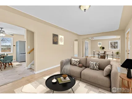 a living room with furniture and a rug