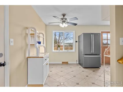 a kitchen with stainless steel appliances granite countertop a refrigerator a sink a stove and island