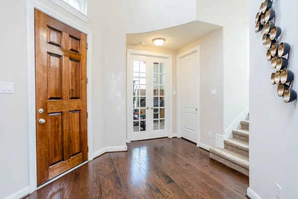 an entryway at livingroom with furniture and wooden floor