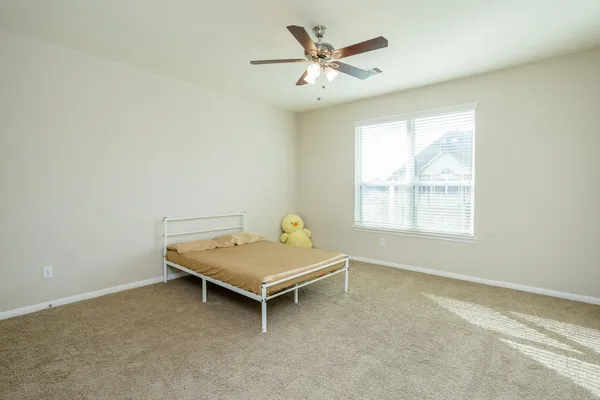 a room with pool table and windows