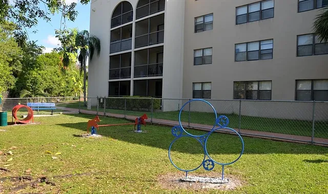 a view of pool with a backyard