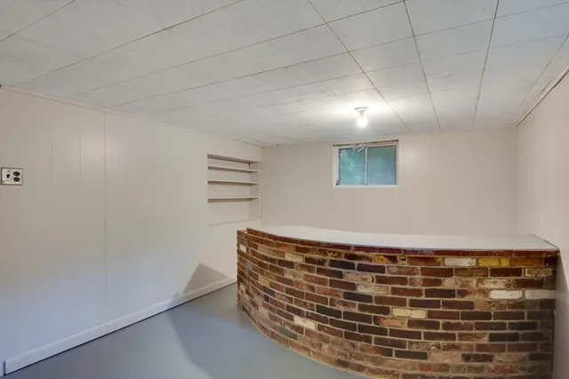 wooden floor in an empty room with a fireplace
