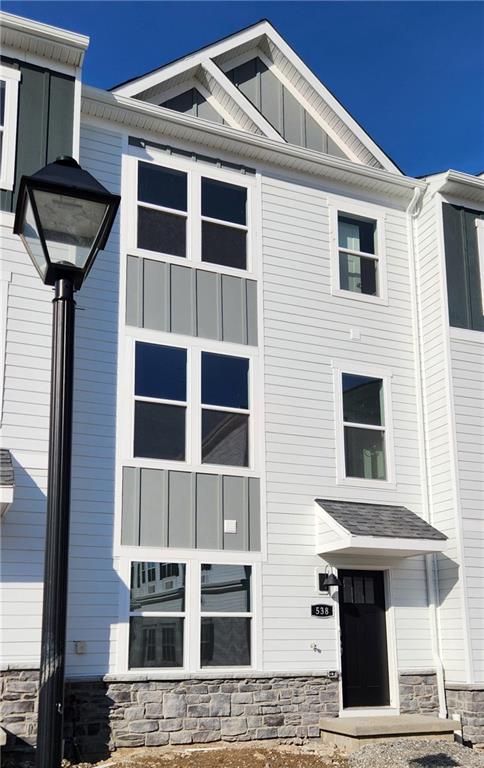 a front view of a house with glass windows