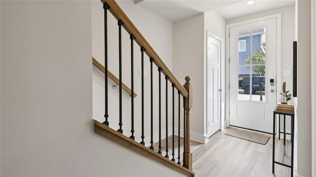 538 Cooper Street Wexford, PA 15090 - Photo 2 of 14 a view of a hallway with wooden floor and staircase