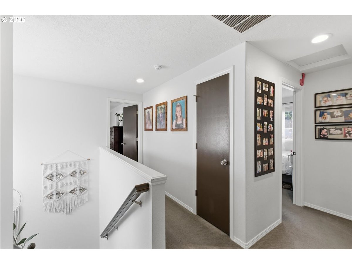 229 Hazelbrook Drive North Keizer, OR 97303 - Photo 28 of 48 a view of a hallway with wooden floor and stairs