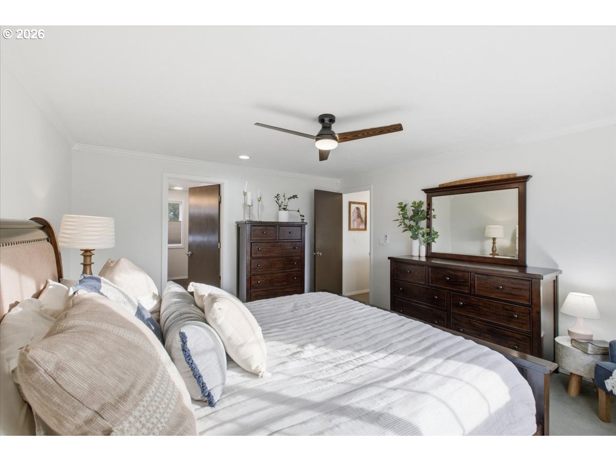 229 Hazelbrook Drive North Keizer, OR 97303 - Photo 33 of 48 a bedroom with a bed and a chandelier