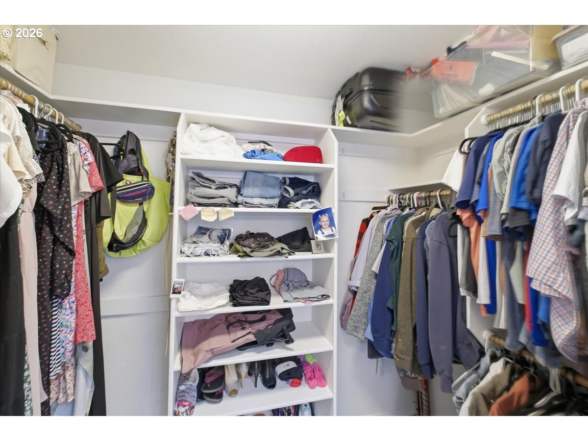 229 Hazelbrook Drive North Keizer, OR 97303 - Photo 34 of 48 a view of walk in closet with clothes and shoes
