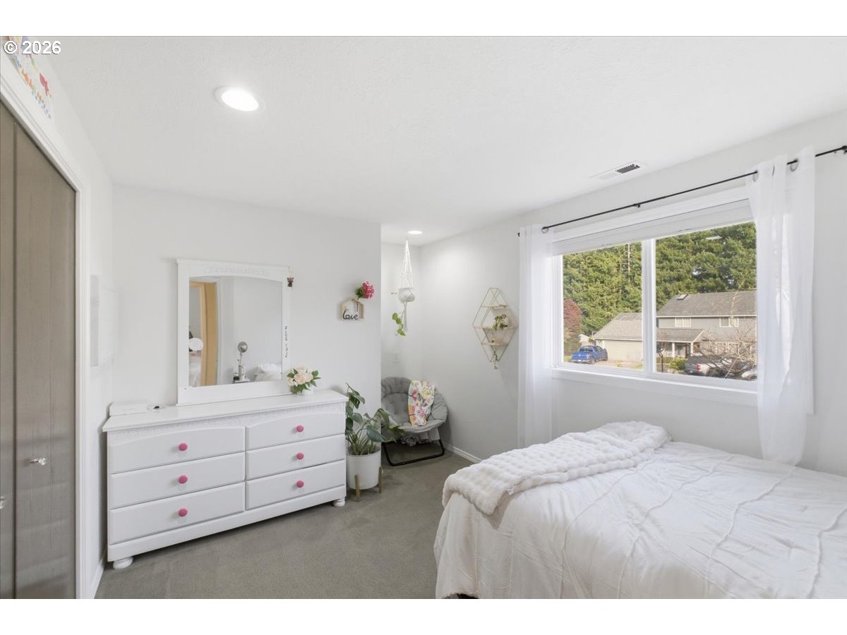 229 Hazelbrook Drive North Keizer, OR 97303 - Photo 37 of 48 a bedroom with a bed and a window