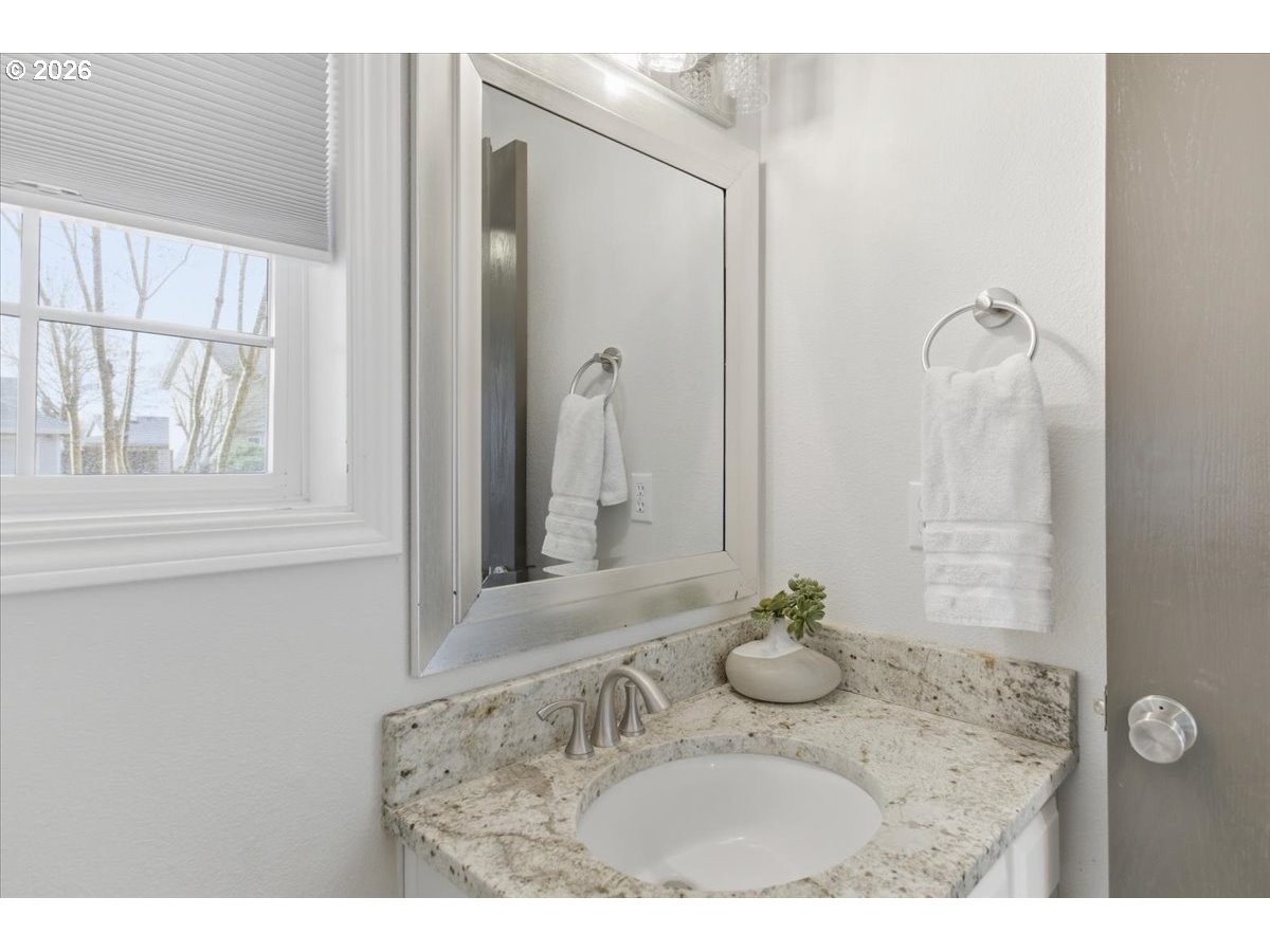 229 Hazelbrook Drive North Keizer, OR 97303 - Photo 39 of 48 a bathroom with a granite countertop sink a mirror and a shower