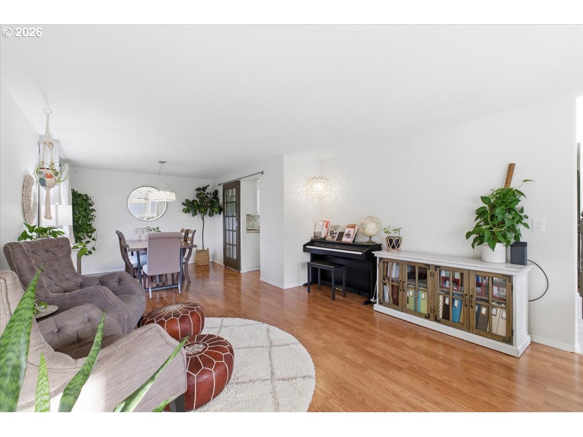 229 Hazelbrook Drive North Keizer, OR 97303 - Photo 9 of 48 a living room with furniture a piano and a bookshelf