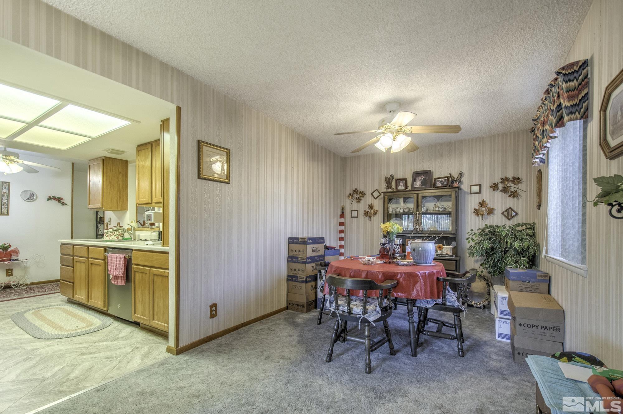 2626 Rice Road Fallon, NV 89406 - Photo 12 of 39 a room with furniture and chandelier
