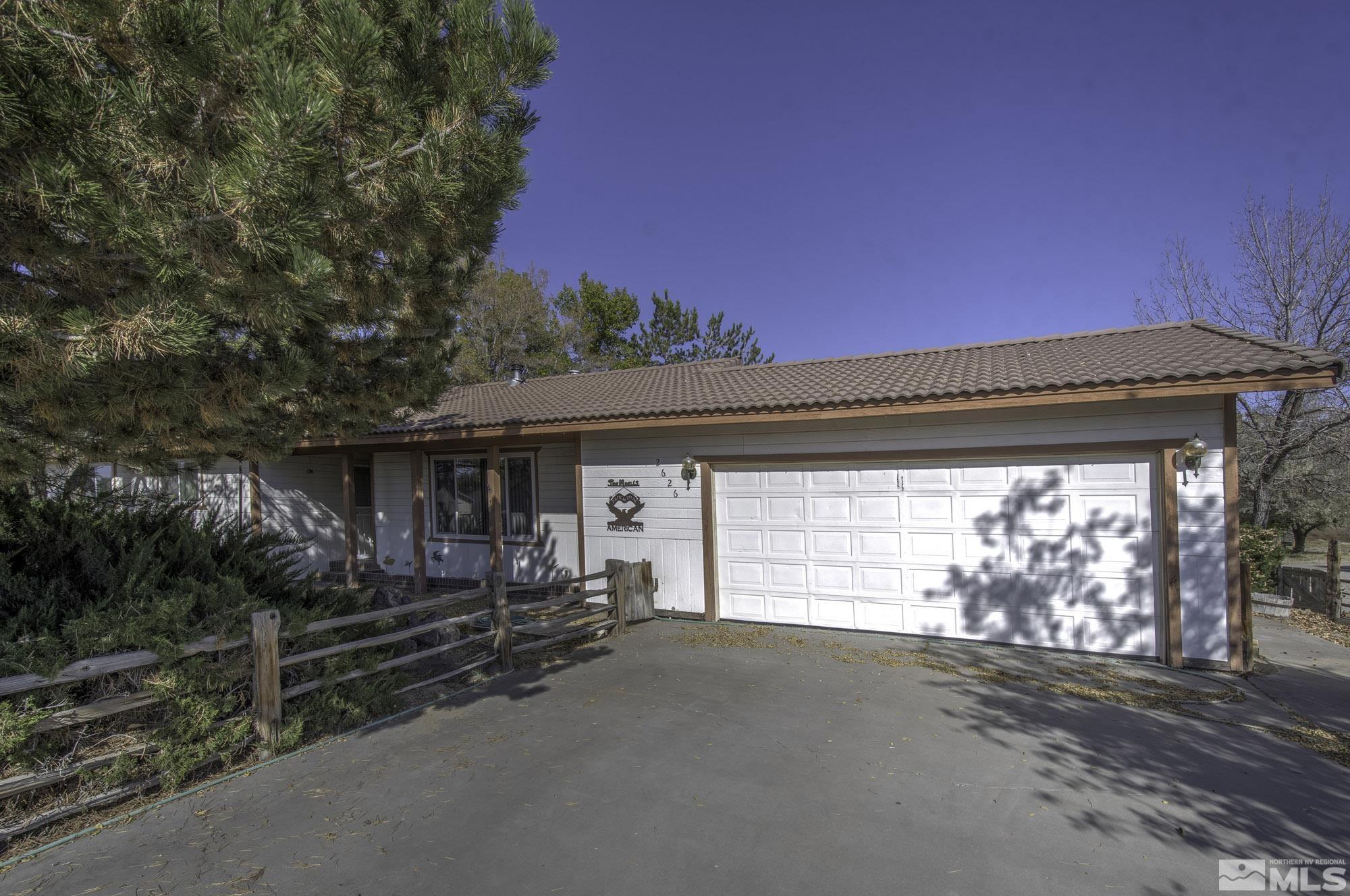 2626 Rice Road Fallon, NV 89406 - Photo 2 of 39 a view of a car garage door