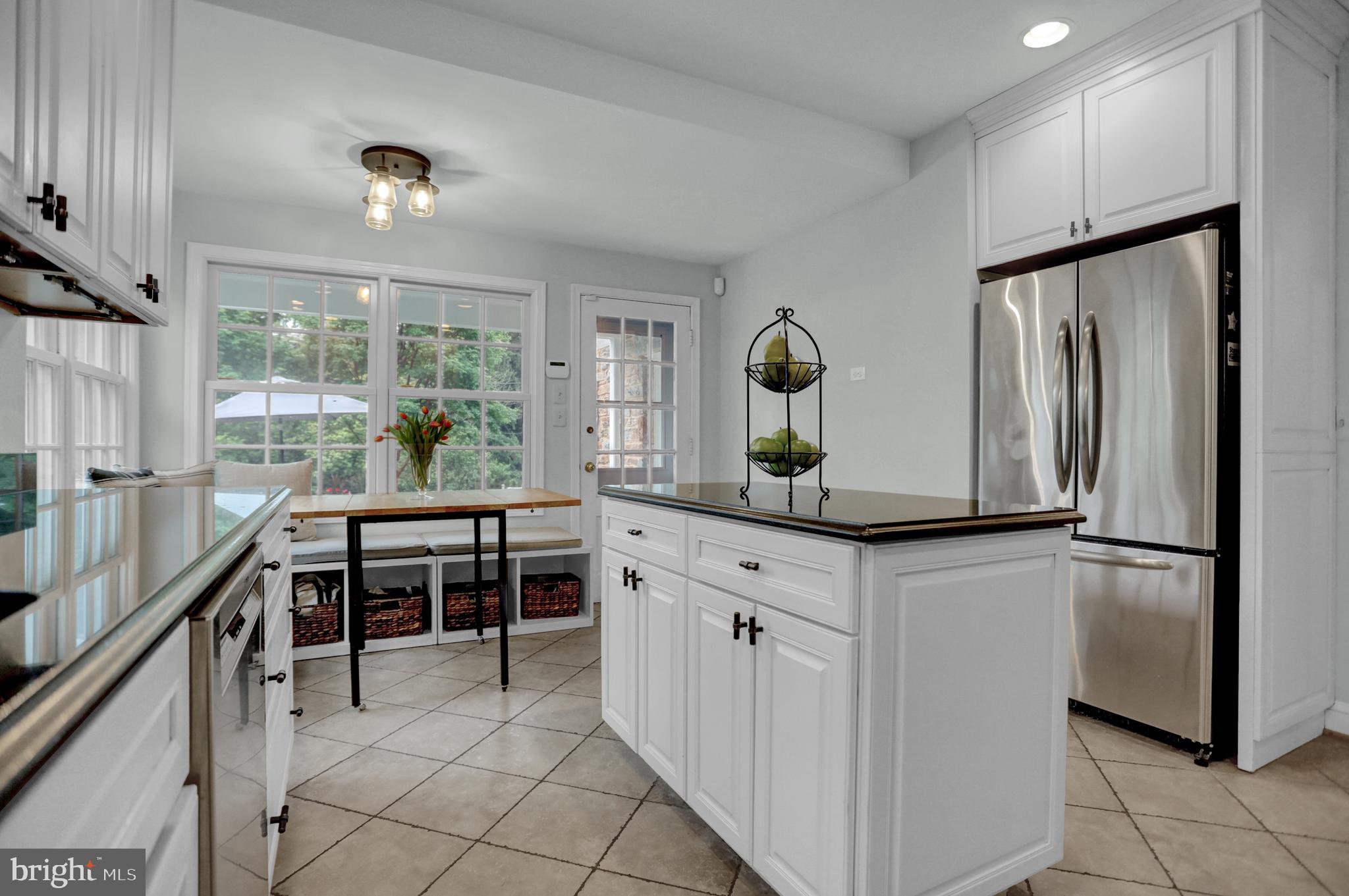 121 Croydon Road Baltimore, MD 21212 - Photo 11 of 57 a kitchen with stainless steel appliances granite countertop a refrigerator and a stove