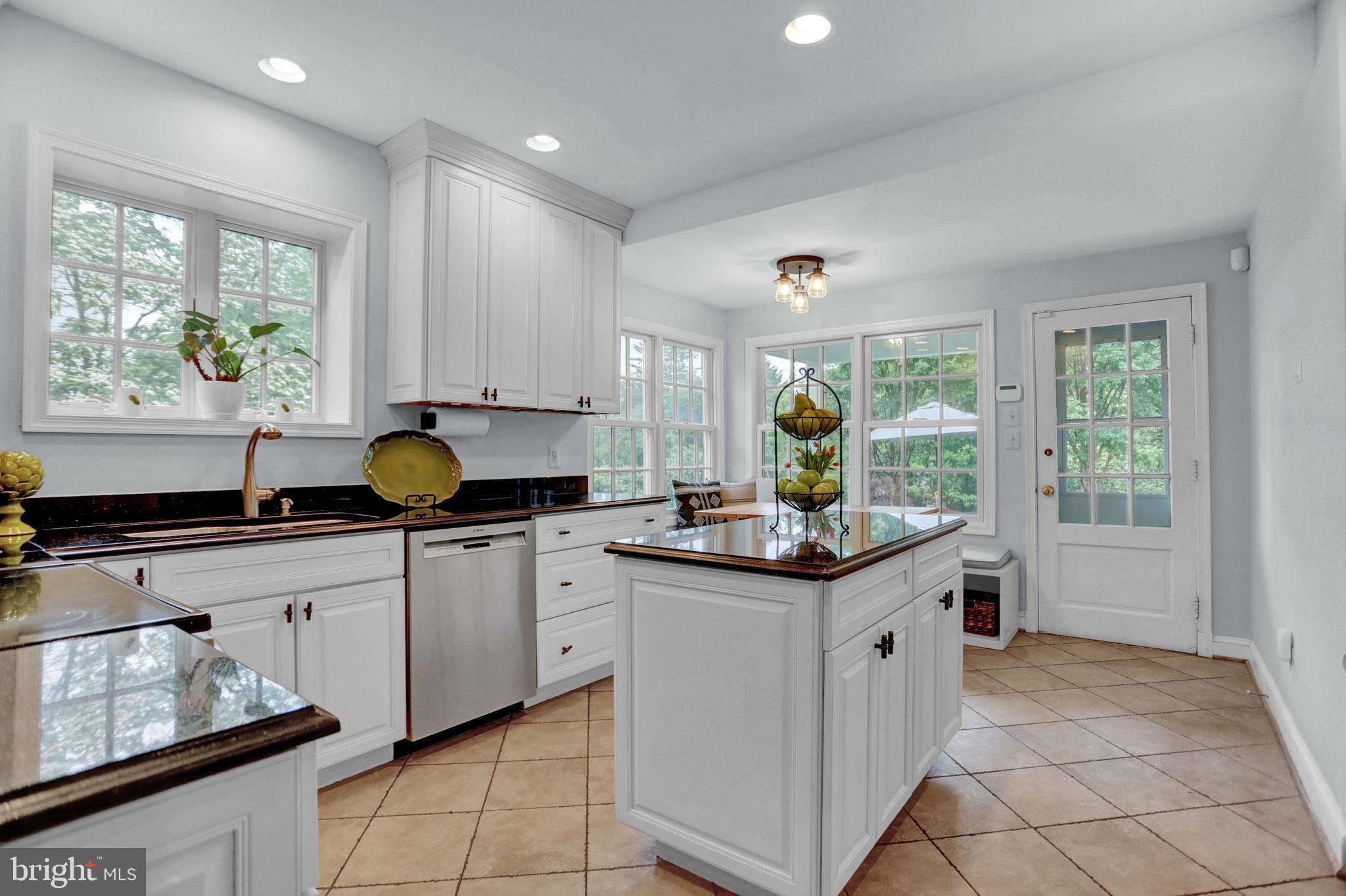 121 Croydon Road Baltimore, MD 21212 - Photo 12 of 57 a kitchen with a sink and wooden cabinets
