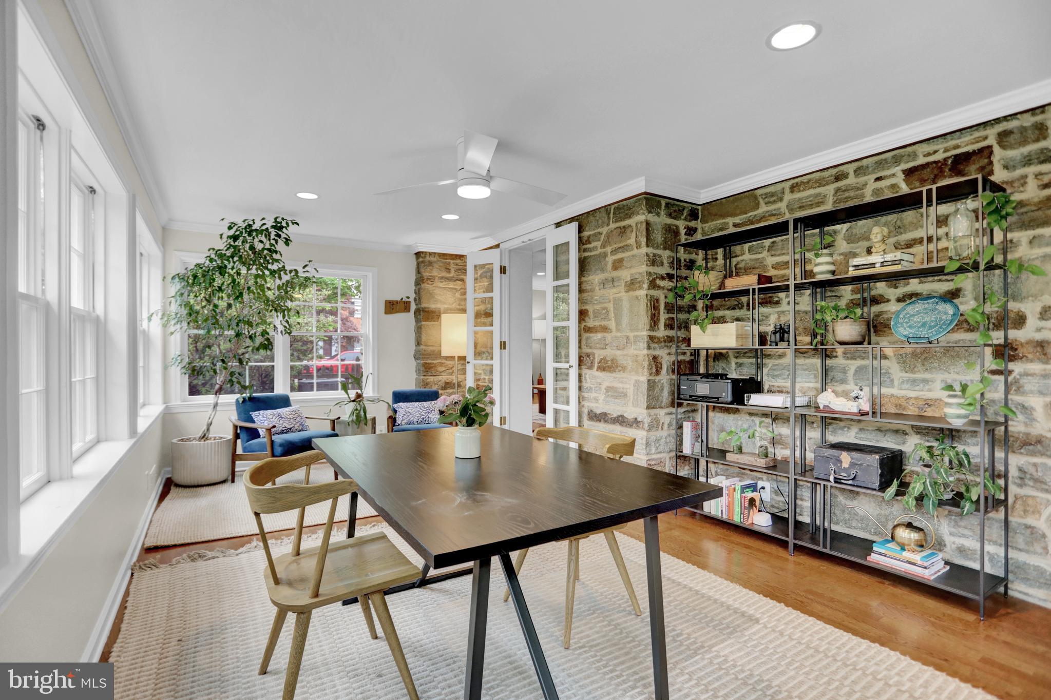 121 Croydon Road Baltimore, MD 21212 - Photo 16 of 57 a living room with furniture and a floor to ceiling window