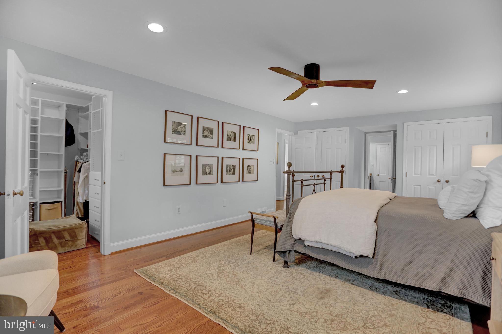 121 Croydon Road Baltimore, MD 21212 - Photo 22 of 57 a spacious bedroom with a bed and a chandelier