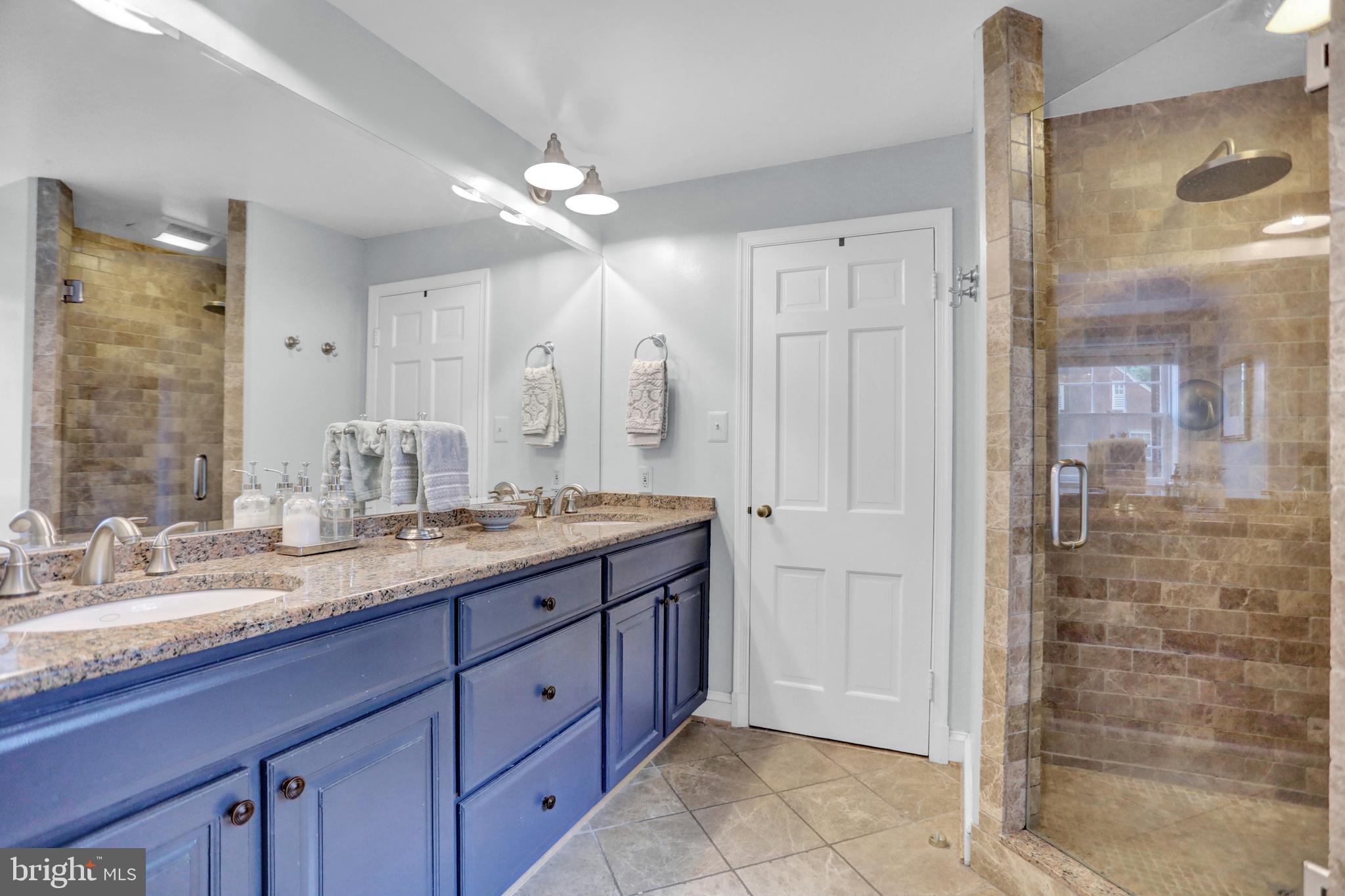 121 Croydon Road Baltimore, MD 21212 - Photo 25 of 57 a bathroom with a granite countertop sink mirror and shower