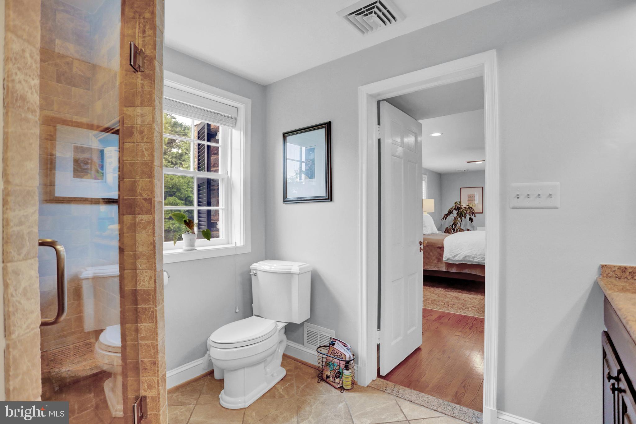 121 Croydon Road Baltimore, MD 21212 - Photo 26 of 57 a bathroom with a toilet a sink and a window