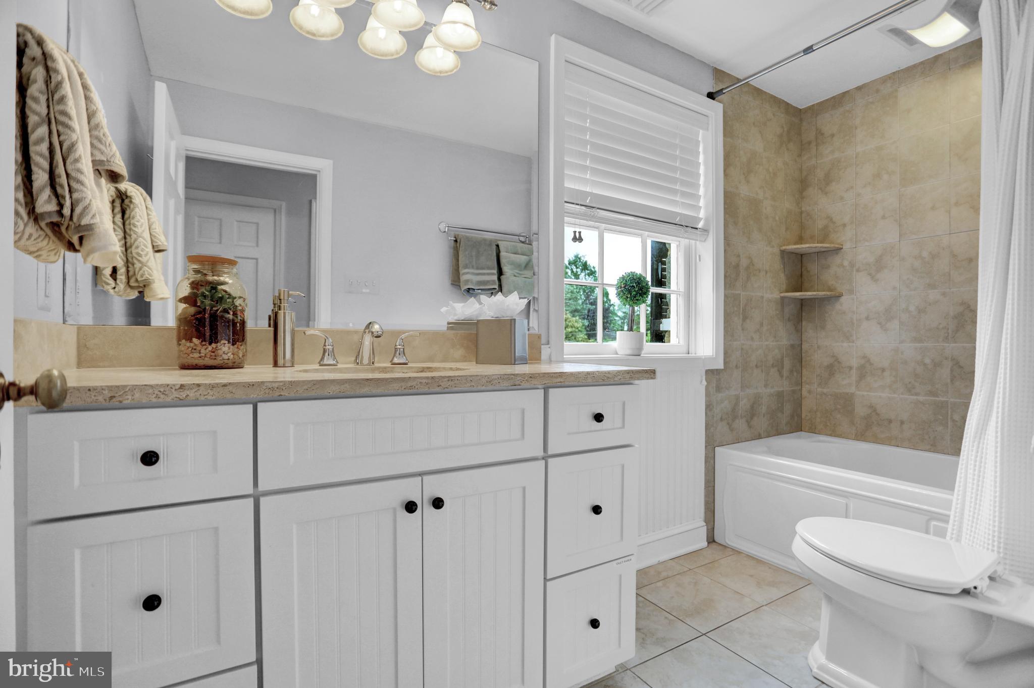 121 Croydon Road Baltimore, MD 21212 - Photo 30 of 57 a bathroom with a sink a toilet and shower