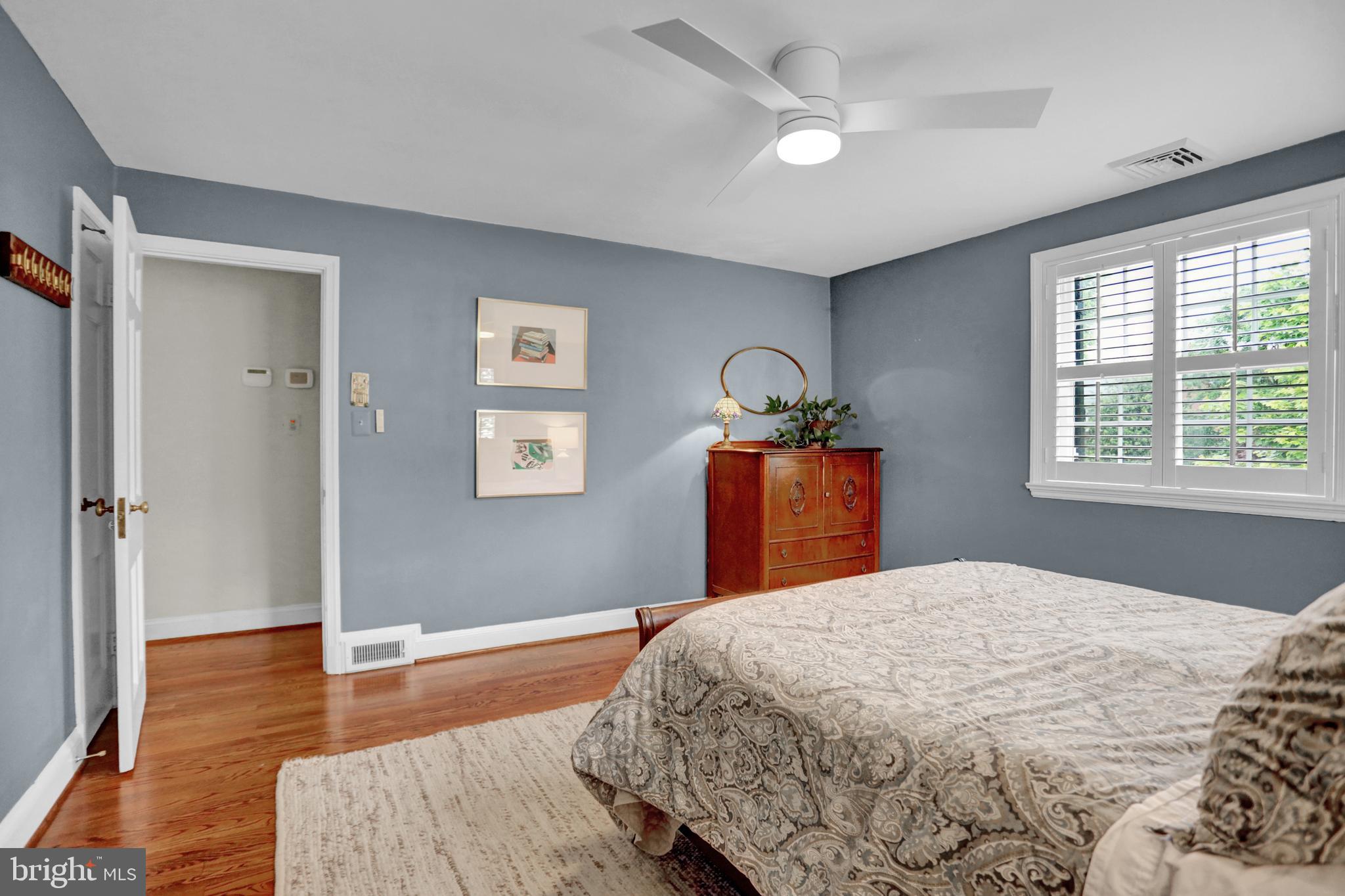 121 Croydon Road Baltimore, MD 21212 - Photo 31 of 57 a bedroom with a bed and wooden floor