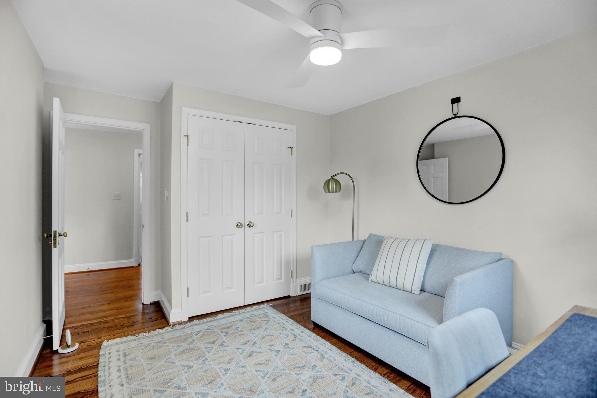121 Croydon Road Baltimore, MD 21212 - Photo 33 of 57 a living room with a couch and a chandelier