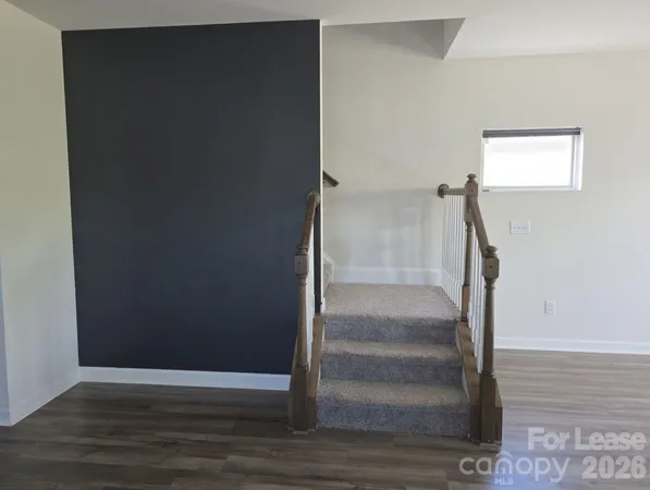 a view of entryway with wooden floor