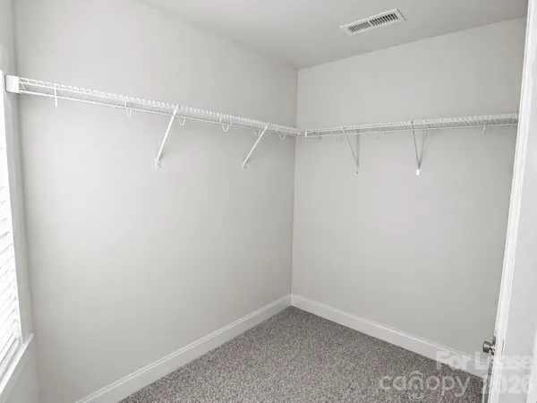 a view of an empty walk in closet