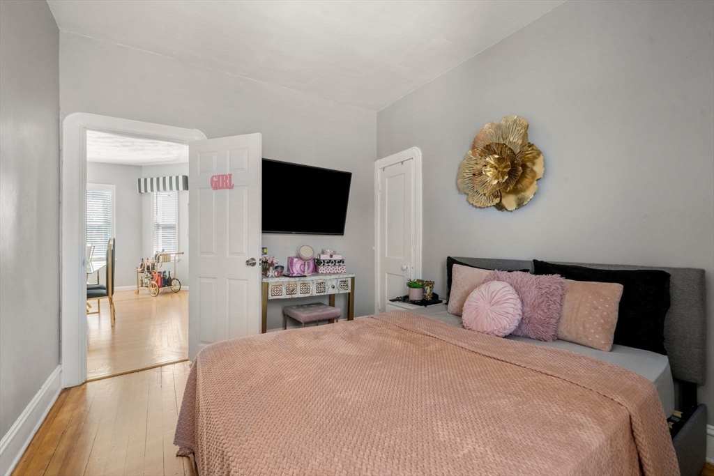 248-250 Jefferson Street Fall River, MA 02721 - Photo 13 of 37 a bedroom with a bed and a flat screen tv