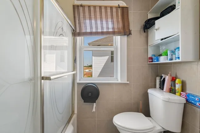 a bathroom with a toilet and a sink