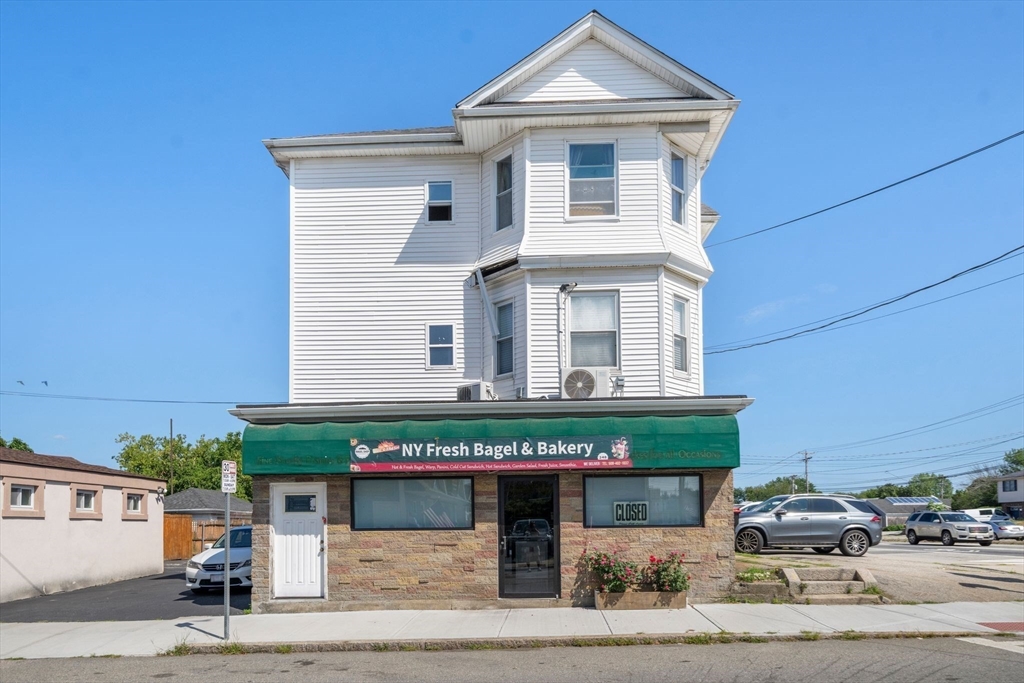 248-250 Jefferson Street Fall River, MA 02721 - Photo 3 of 37 a front view of a house with a garage