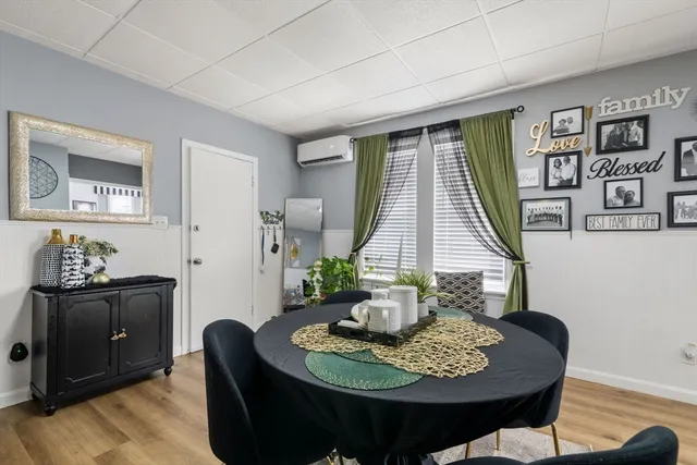 a dining room with furniture and window