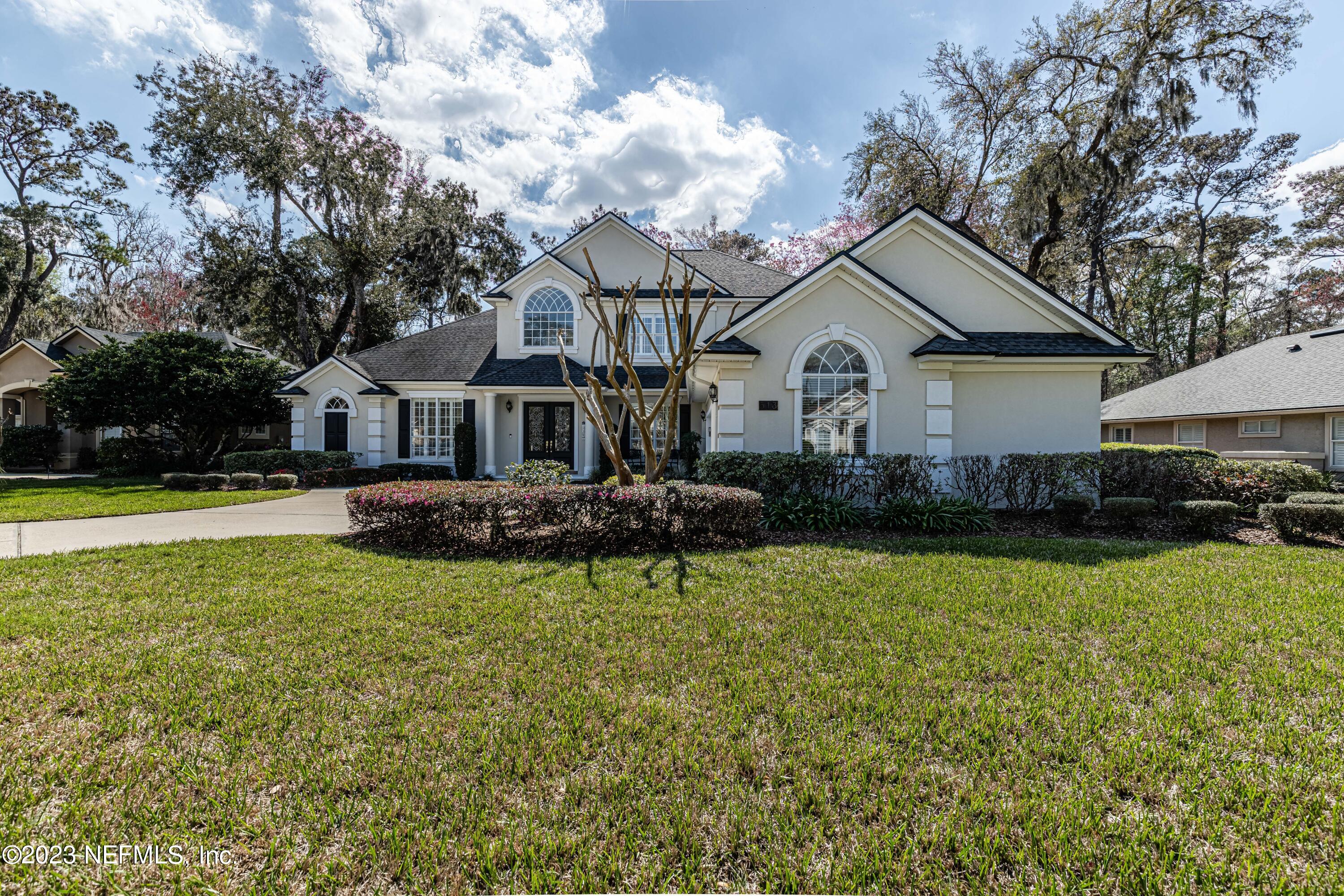 513 Fresh Pond Road Ponte Vedra Beach, FL 32082 - Photo 2 of 58 a front view of a house with garden