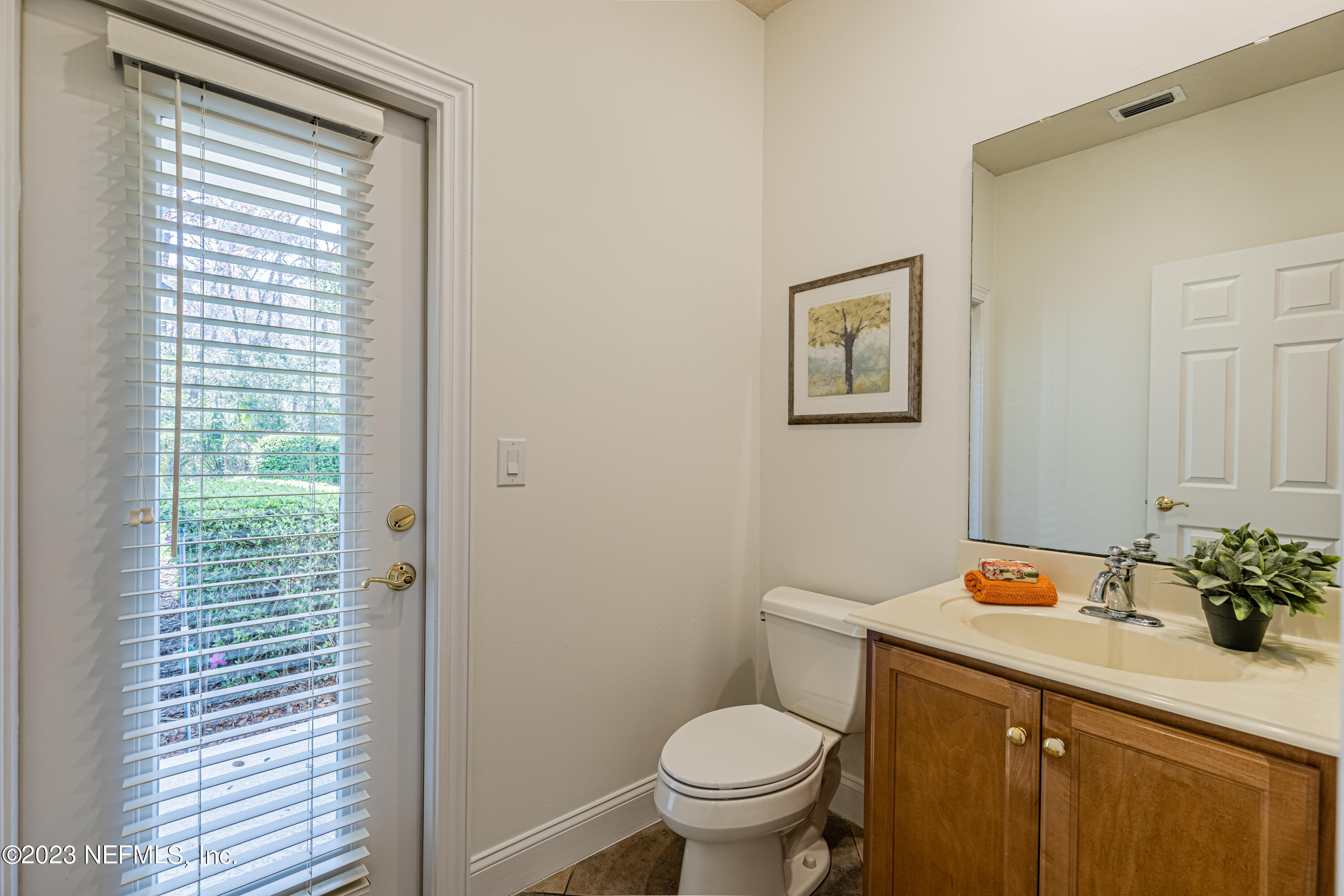 513 Fresh Pond Road Ponte Vedra Beach, FL 32082 - Photo 21 of 58 a bathroom with a toilet sink vanity and mirror