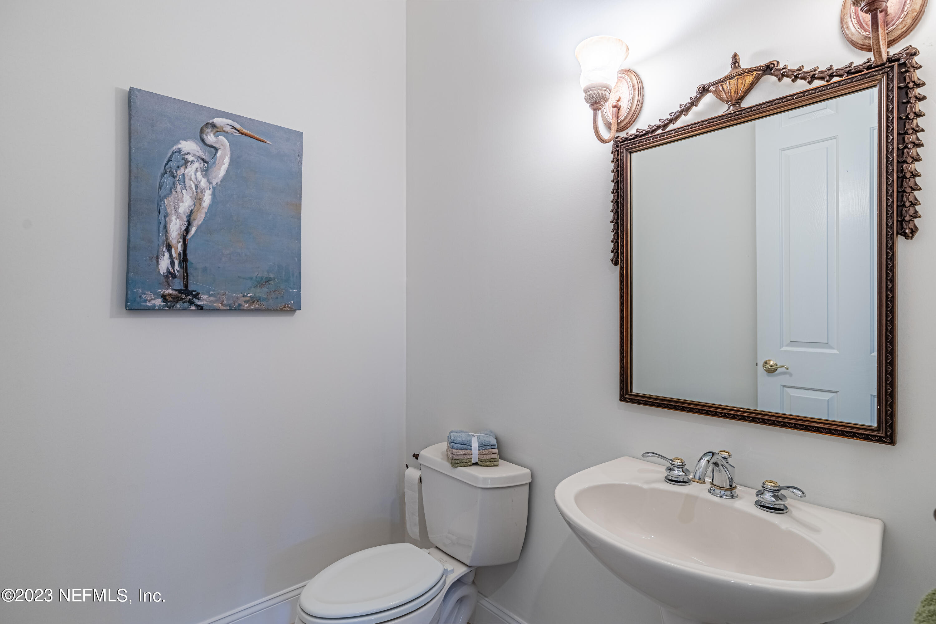 513 Fresh Pond Road Ponte Vedra Beach, FL 32082 - Photo 22 of 58 a bathroom with a toilet sink and mirror