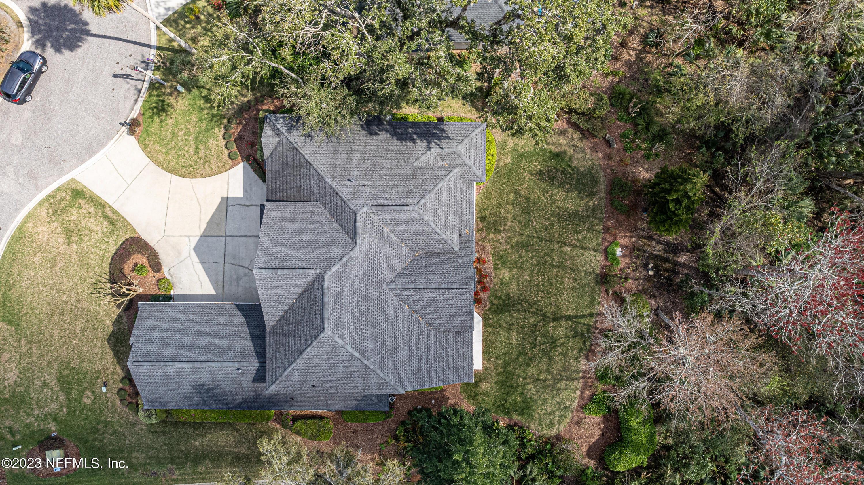 513 Fresh Pond Road Ponte Vedra Beach, FL 32082 - Photo 26 of 58 an aerial view of a house with a yard and large trees