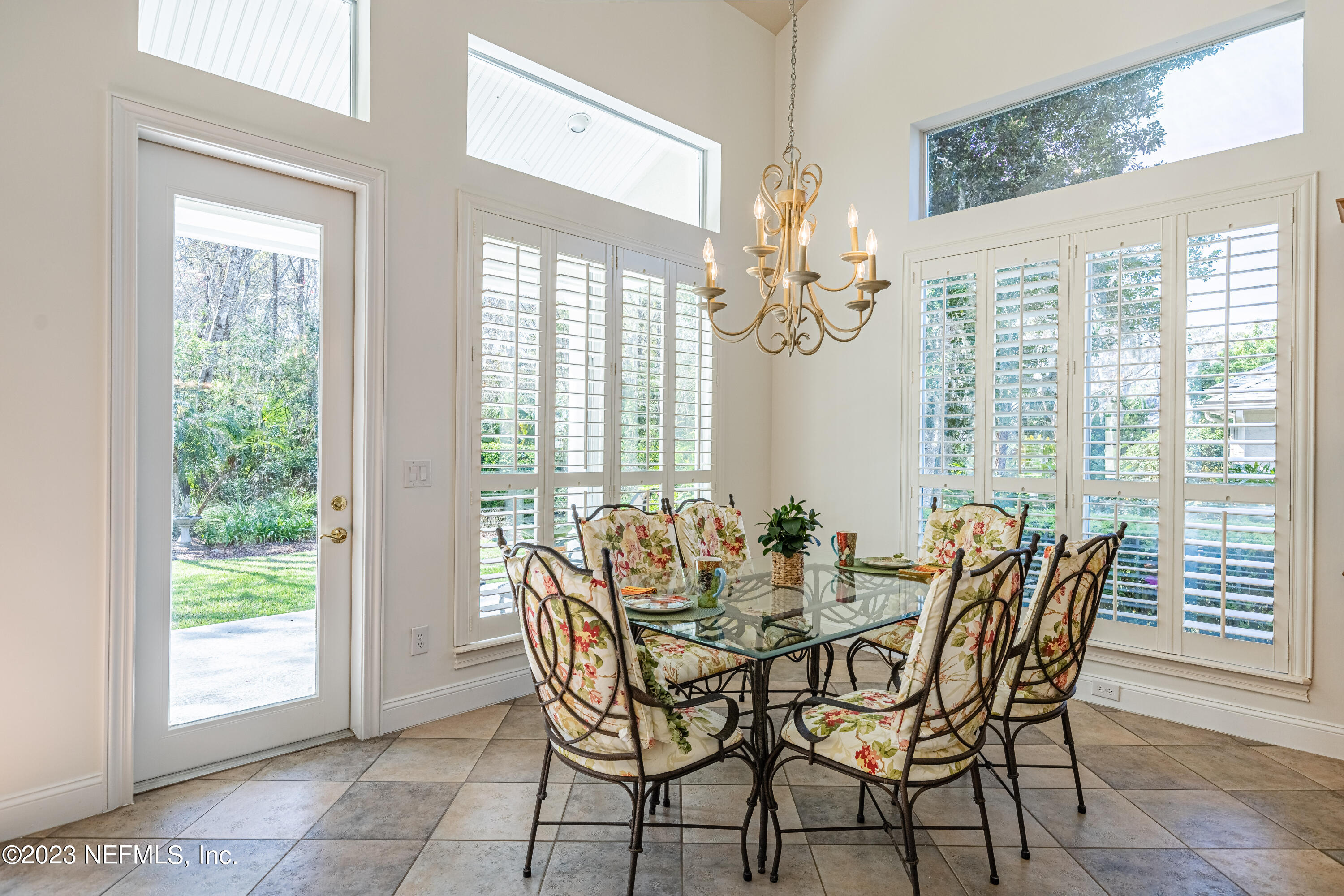 513 Fresh Pond Road Ponte Vedra Beach, FL 32082 - Photo 30 of 58 a view of a dining room with furniture and chandelier