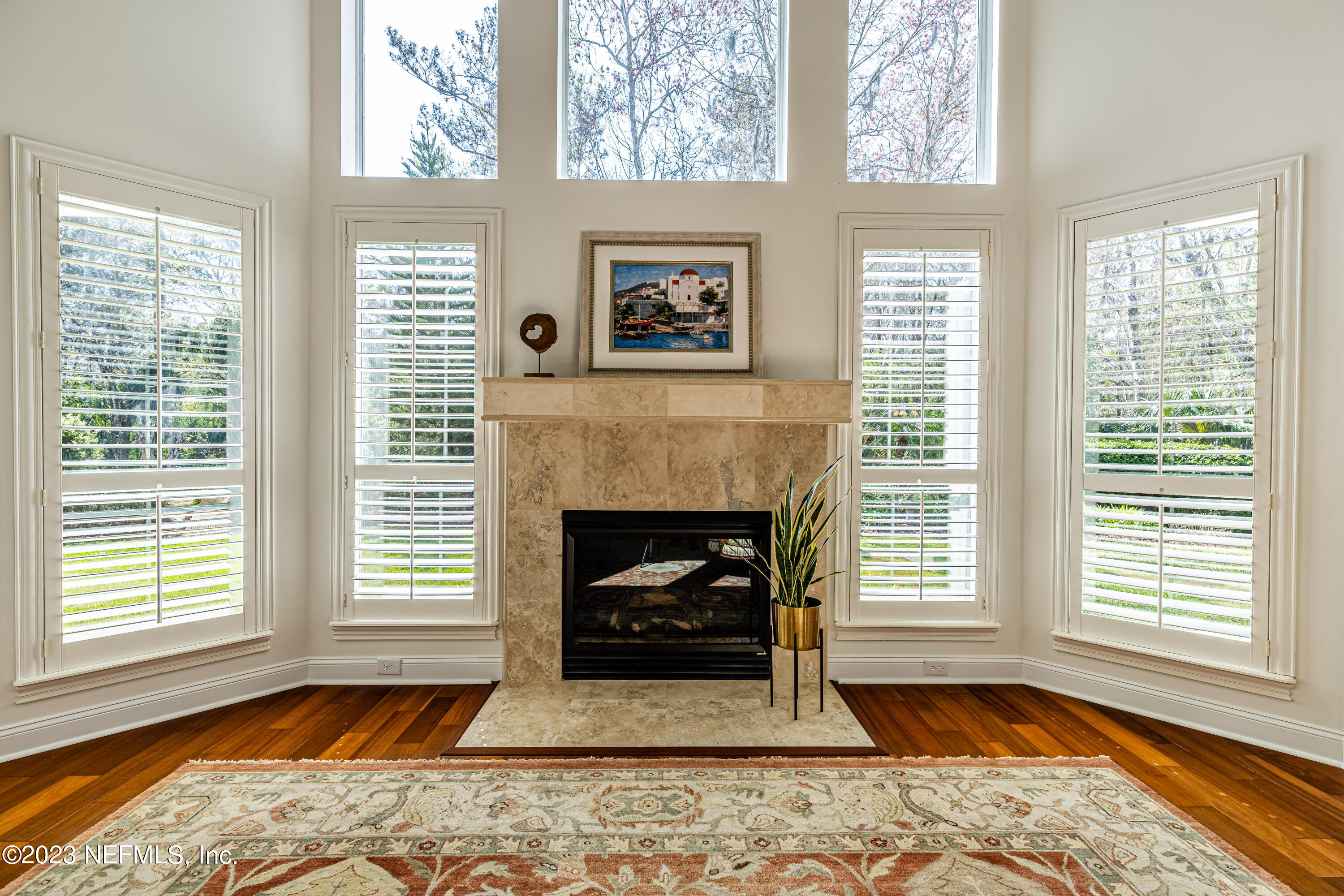 513 Fresh Pond Road Ponte Vedra Beach, FL 32082 - Photo 3 of 58 a living room with a fireplace and windows
