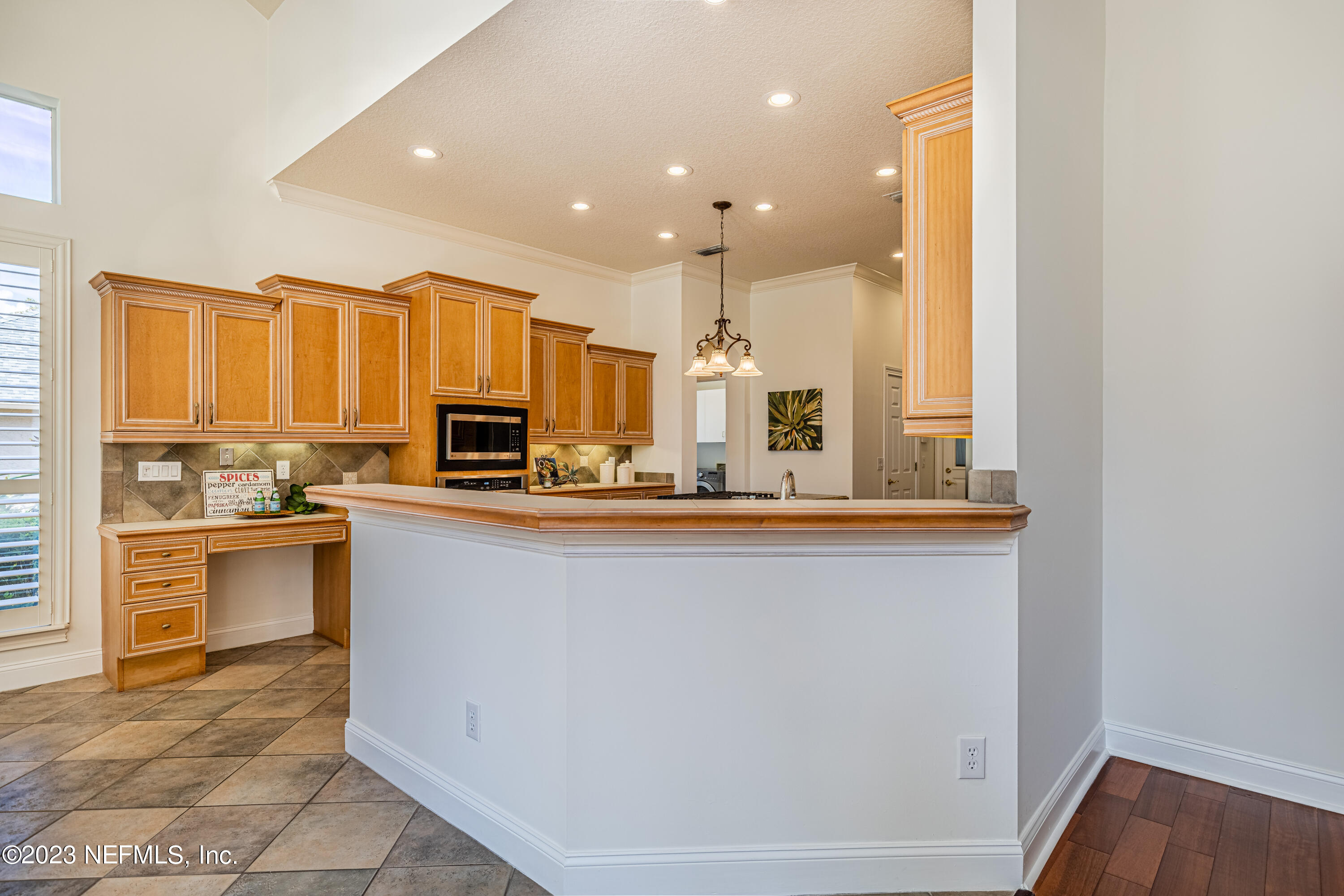513 Fresh Pond Road Ponte Vedra Beach, FL 32082 - Photo 32 of 58 a kitchen with stainless steel appliances granite countertop a refrigerator and a stove top oven