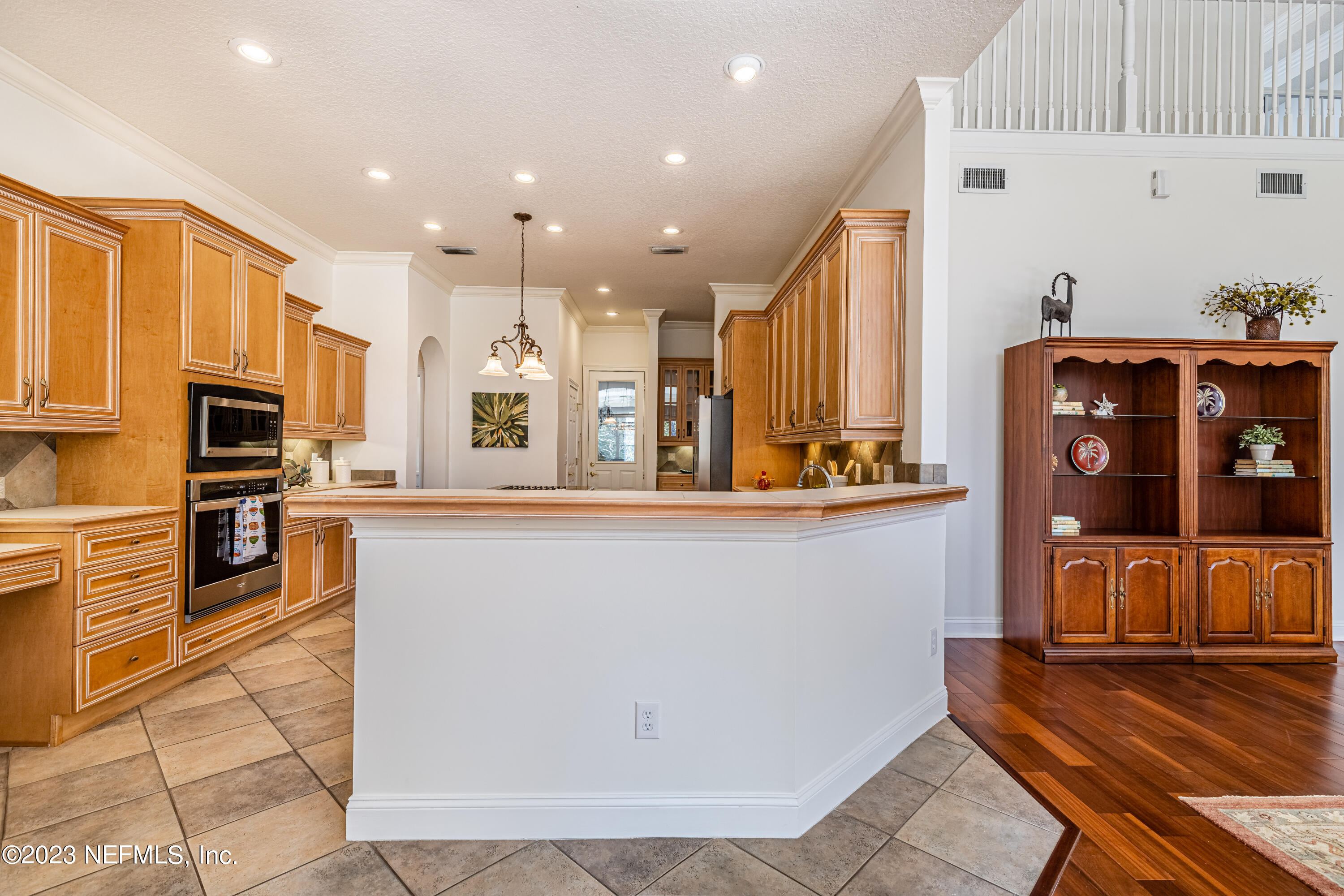 513 Fresh Pond Road Ponte Vedra Beach, FL 32082 - Photo 33 of 58 a kitchen with stainless steel appliances granite countertop a refrigerator and microwave