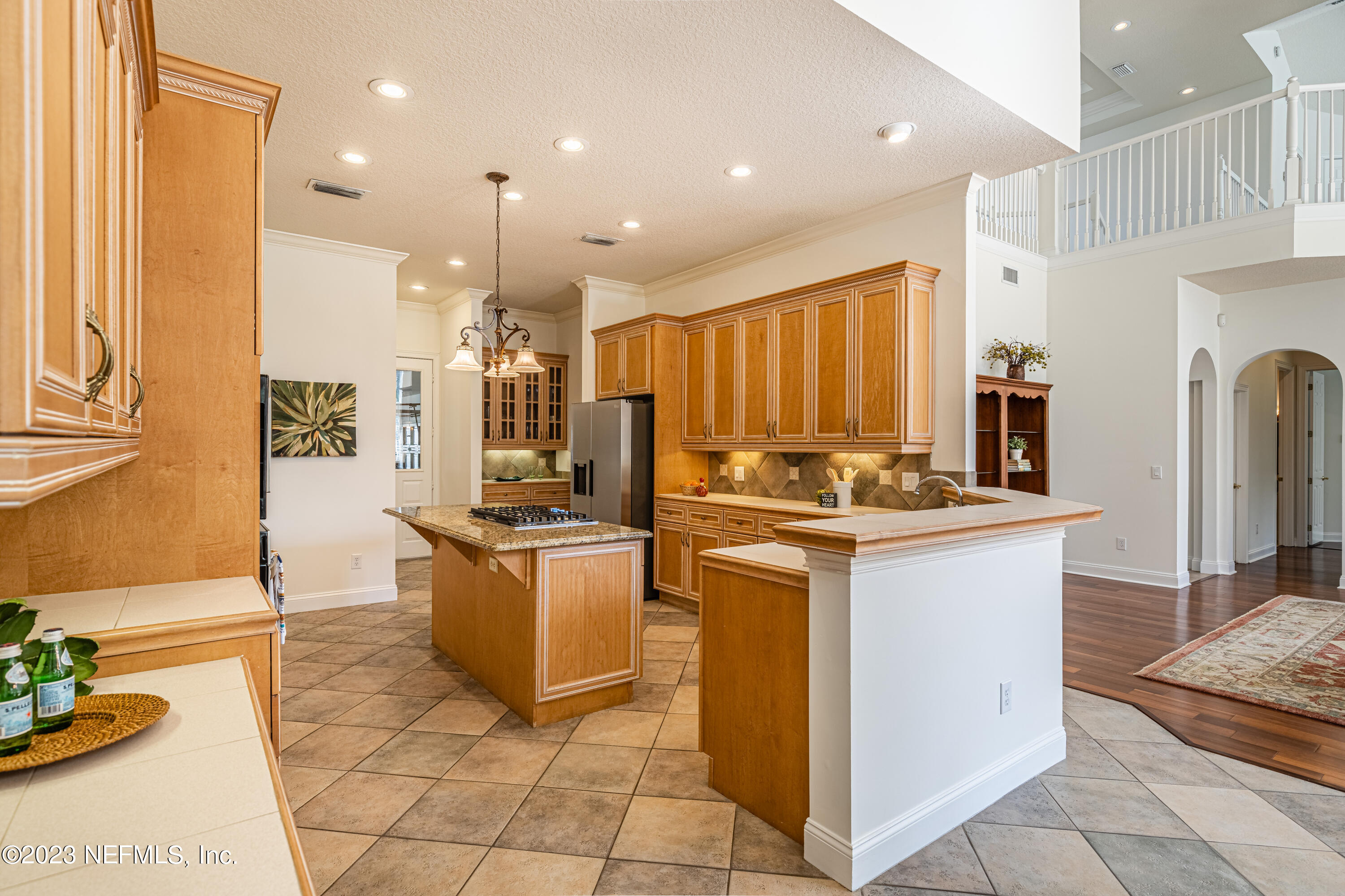 513 Fresh Pond Road Ponte Vedra Beach, FL 32082 - Photo 34 of 58 a kitchen with stainless steel appliances granite countertop a stove and a refrigerator