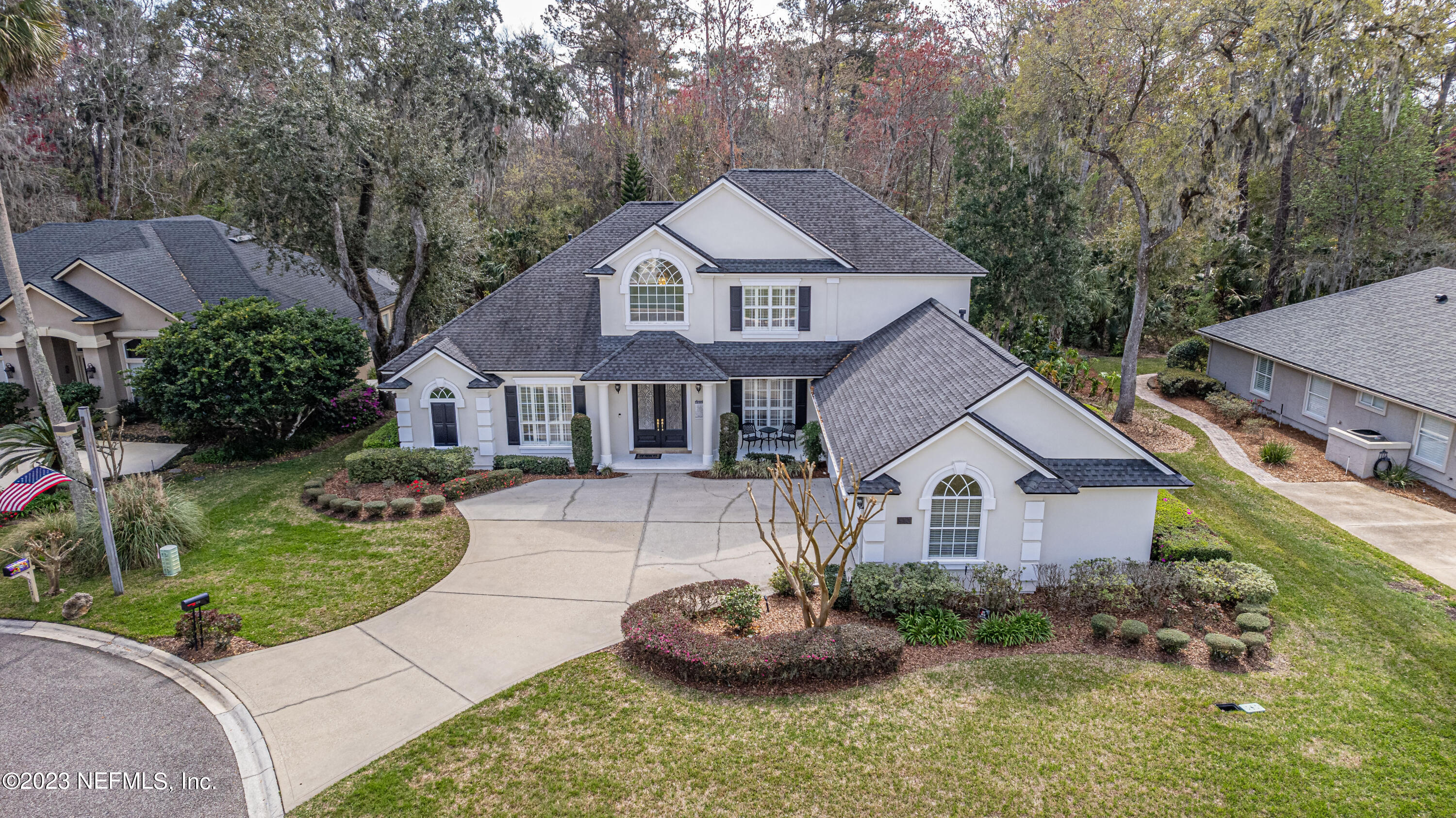 513 Fresh Pond Road Ponte Vedra Beach, FL 32082 - Photo 39 of 58 a front view of a house with a yard and garage