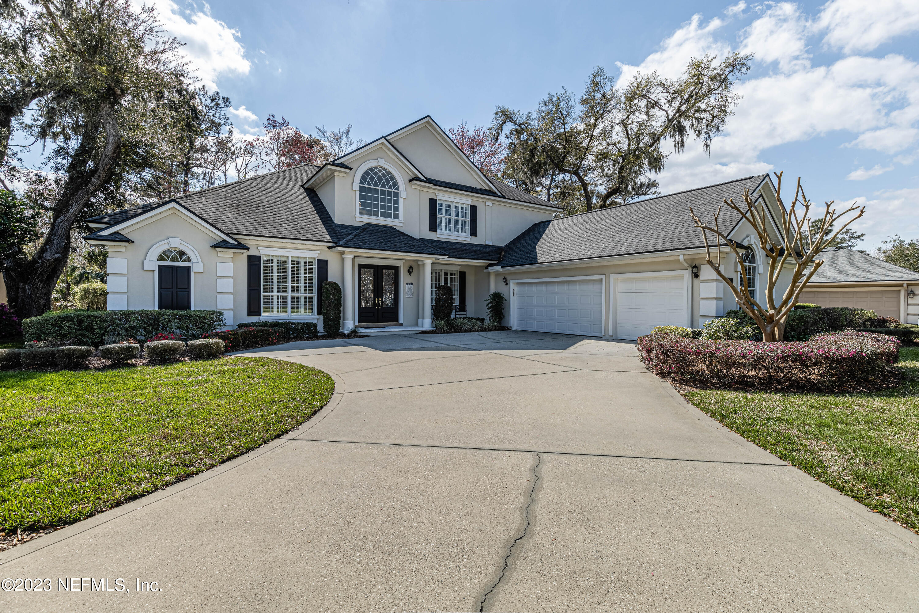 513 Fresh Pond Road Ponte Vedra Beach, FL 32082 - Photo 48 of 58 a front view of a house with a garden and trees
