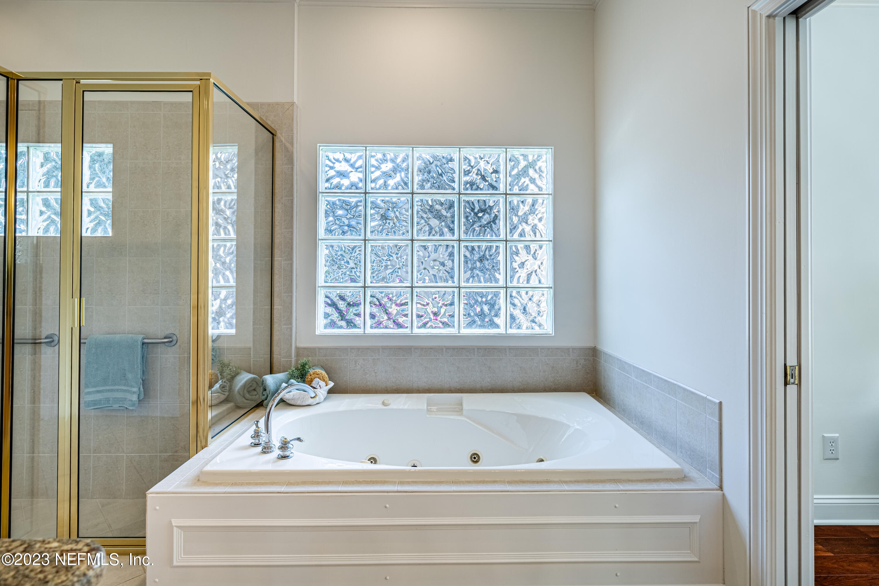 513 Fresh Pond Road Ponte Vedra Beach, FL 32082 - Photo 5 of 58 a bathroom with a bathtub and shower