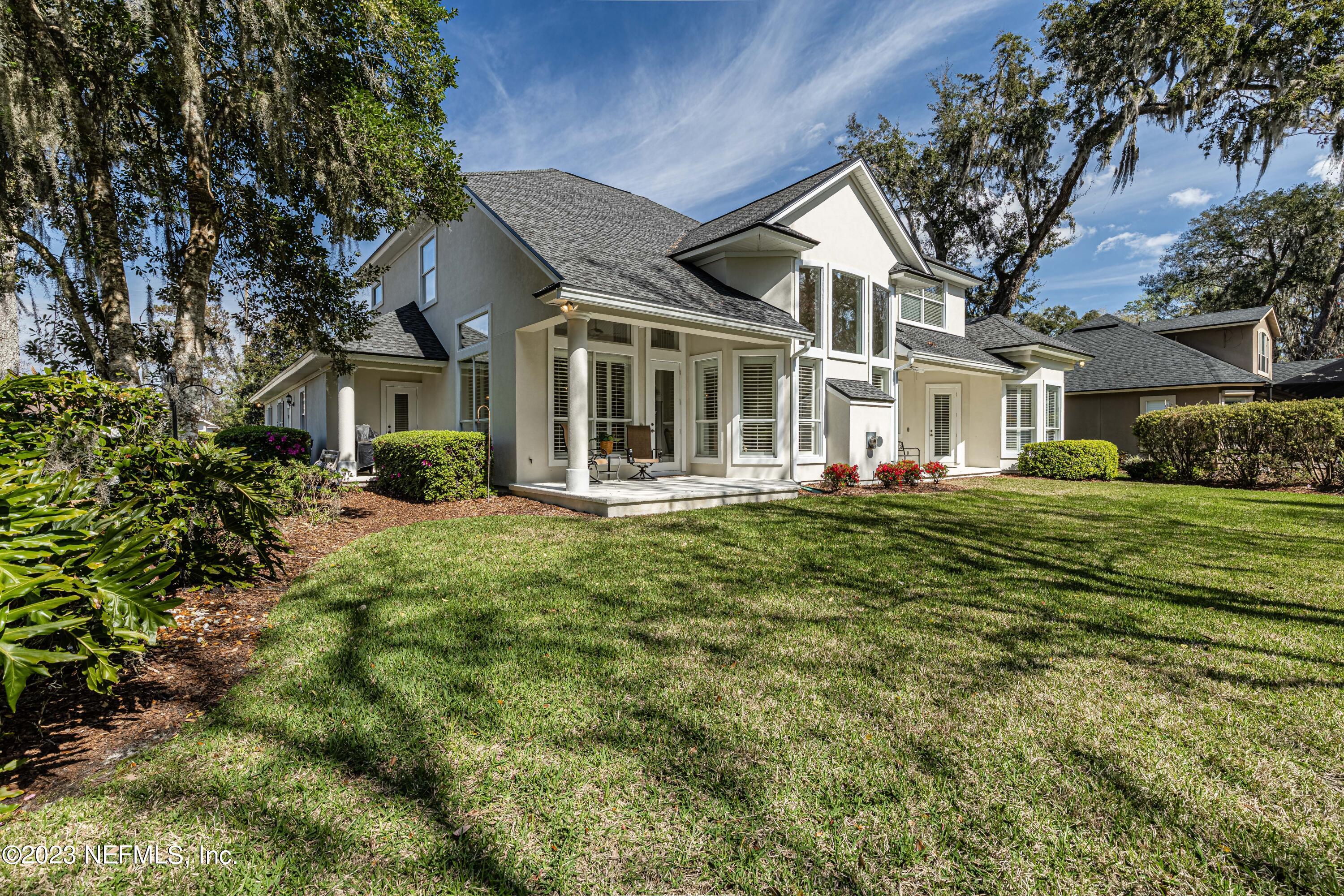 513 Fresh Pond Road Ponte Vedra Beach, FL 32082 - Photo 53 of 58 a front view of a house with a garden