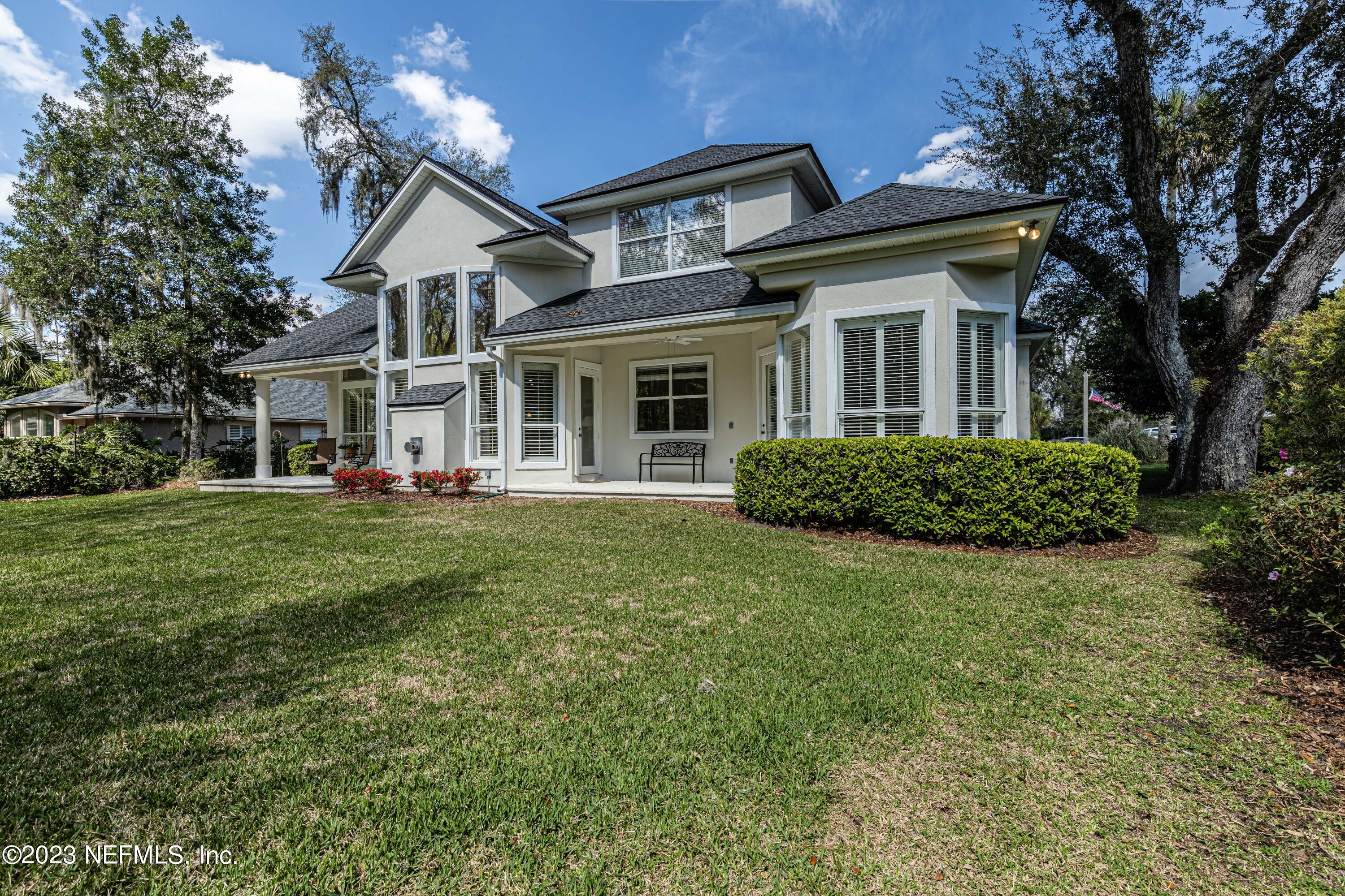 513 Fresh Pond Road Ponte Vedra Beach, FL 32082 - Photo 54 of 58 a front view of a house with a garden