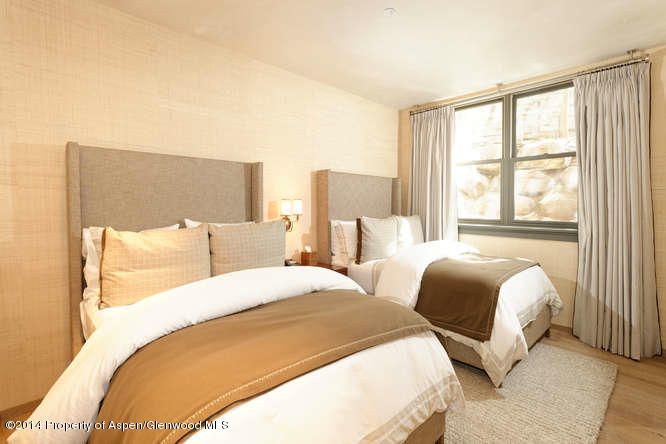 1240 Riverside Drive Aspen, CO 81611 - Photo 14 of 17 a bedroom with two beds and a large window