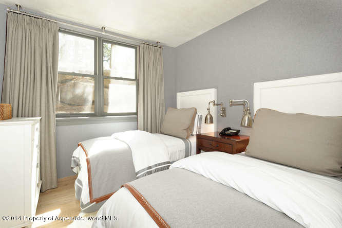1240 Riverside Drive Aspen, CO 81611 - Photo 15 of 17 a bedroom with two beds and a large window