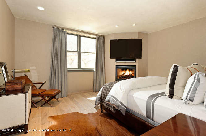 1240 Riverside Drive Aspen, CO 81611 - Photo 16 of 17 a bedroom with bed and a flat screen tv