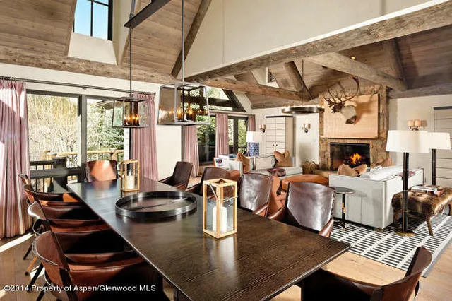 a living room with lots of furniture and a table