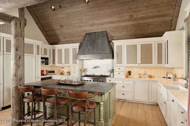 1240 Riverside Drive Aspen, CO 81611 - Photo 7 of 17 a kitchen with stainless steel appliances a sink stove and cabinets